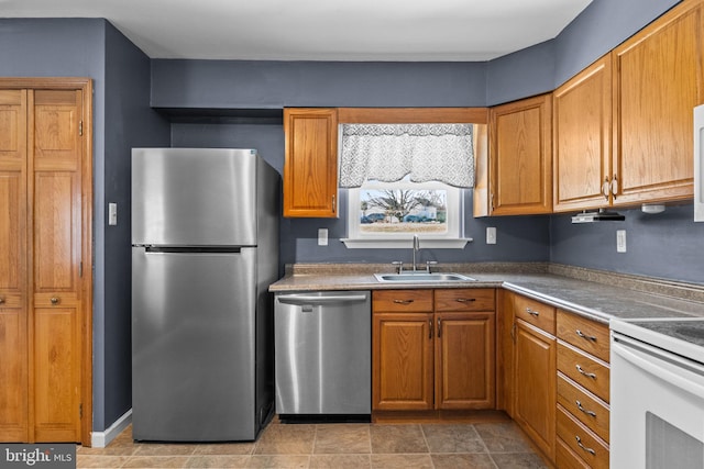 kitchen with sink and appliances with stainless steel finishes