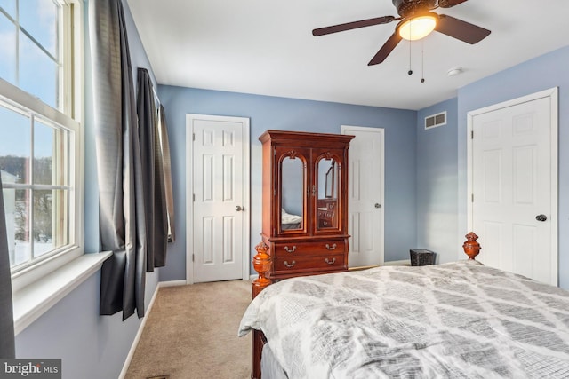 carpeted bedroom with ceiling fan