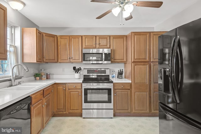 kitchen with sink, black appliances, and ceiling fan