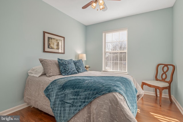 bedroom featuring hardwood / wood-style flooring and ceiling fan