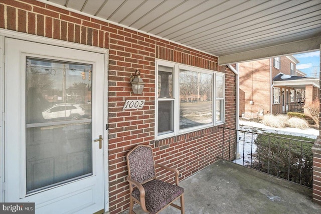 doorway to property featuring a porch