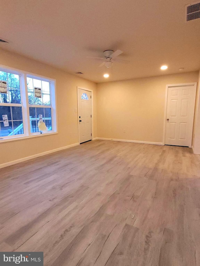 foyer featuring ceiling fan and light hardwood / wood-style floors