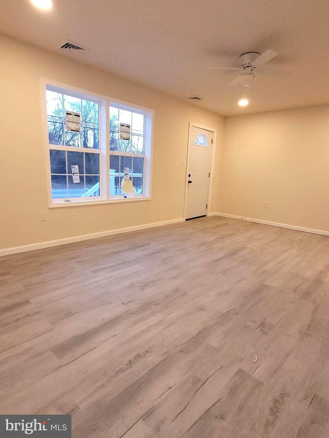 foyer featuring ceiling fan and light wood-type flooring