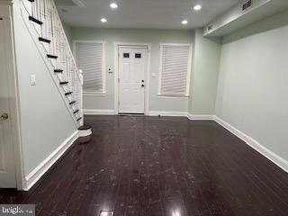 mudroom featuring dark wood-type flooring