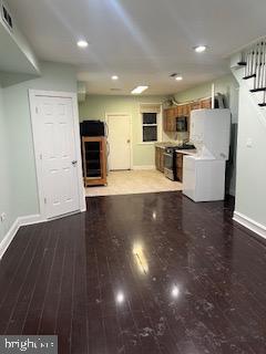 kitchen with stainless steel range with electric stovetop and wood-type flooring