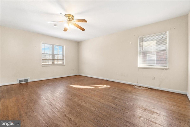 unfurnished room featuring ceiling fan and hardwood / wood-style floors