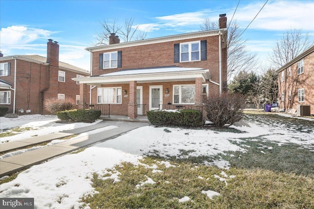 front of property featuring central AC and a porch