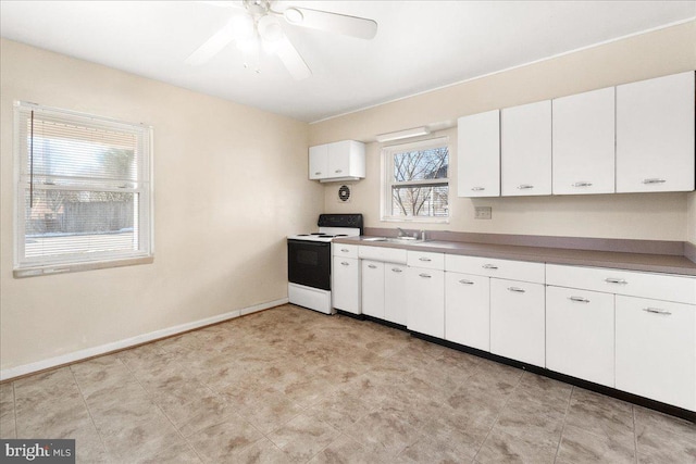 kitchen with white cabinetry, ceiling fan, white electric stove, and sink