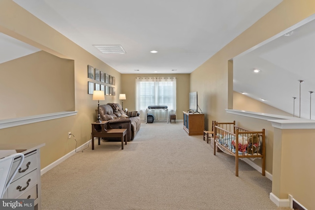 sitting room with light carpet, recessed lighting, lofted ceiling, and baseboards