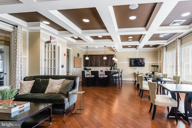 living area with visible vents, beam ceiling, baseboards, and dark wood-style flooring