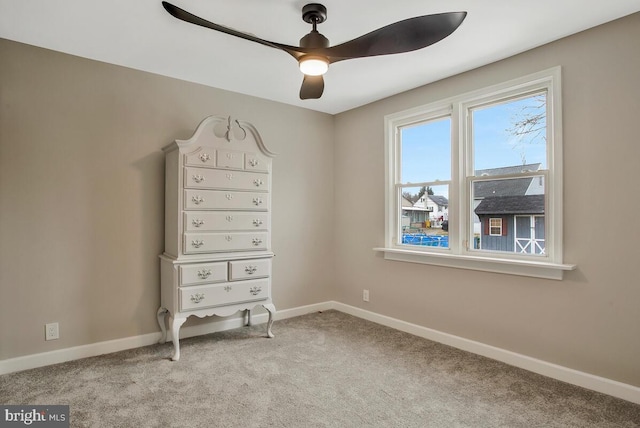 unfurnished bedroom with light colored carpet and ceiling fan