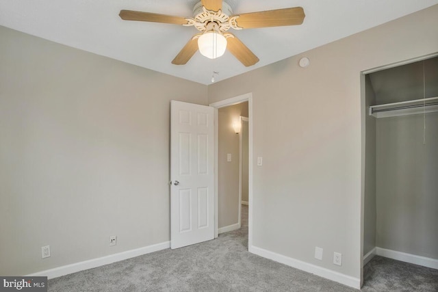 unfurnished bedroom with light colored carpet, ceiling fan, and a closet