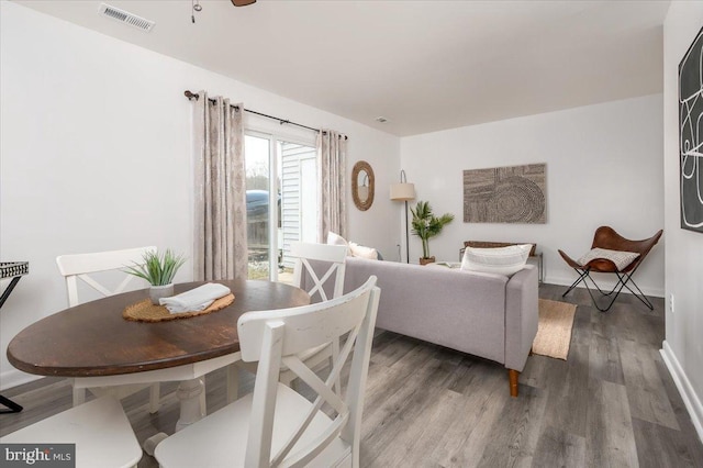 dining area featuring dark hardwood / wood-style floors