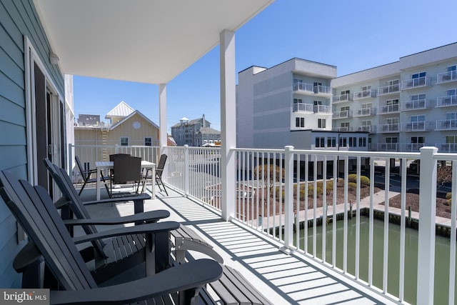 balcony featuring a water view