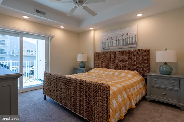 bedroom featuring multiple windows, access to outside, ceiling fan, and dark colored carpet