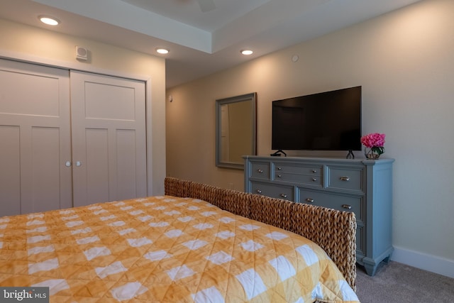 bedroom featuring carpet flooring and a closet