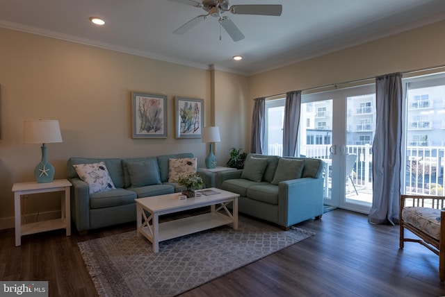 living room with crown molding, ceiling fan, dark hardwood / wood-style flooring, and french doors