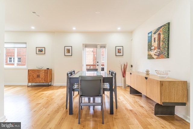 dining space featuring light wood-type flooring