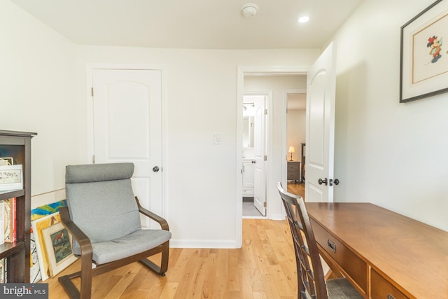 office space with light wood-type flooring