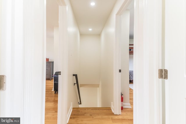 corridor featuring light hardwood / wood-style floors