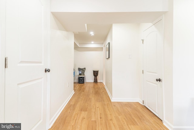 hall with light hardwood / wood-style flooring