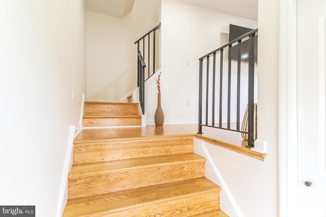 staircase featuring hardwood / wood-style flooring