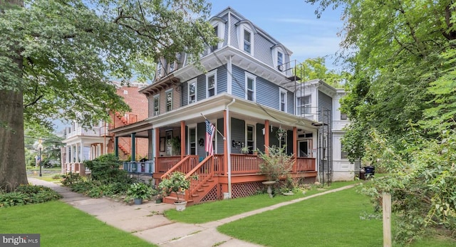 italianate house with a front lawn and covered porch