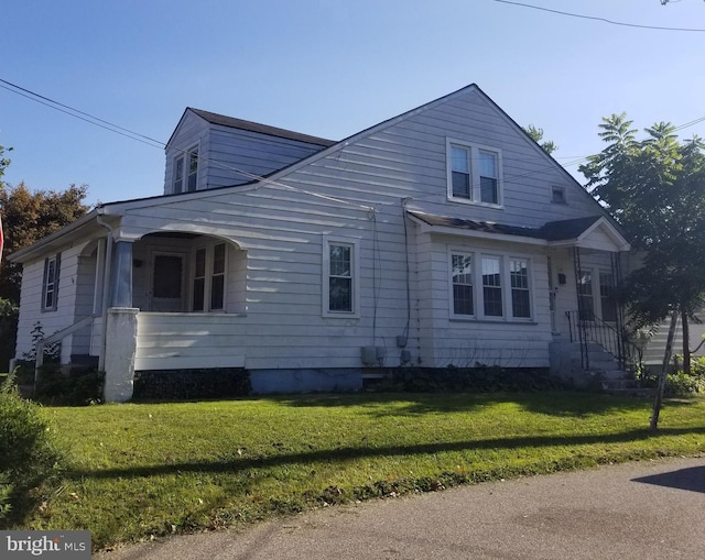 view of home's exterior with a lawn