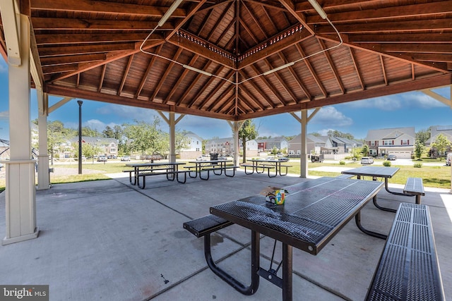 view of property's community with a yard, a residential view, and a gazebo