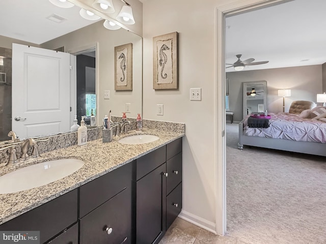 932 Still Pond Dr, Glen Burnie, MD 21060 - ensuite bathroom featuring double vanity, connected bathroom, visible vents, and a sink