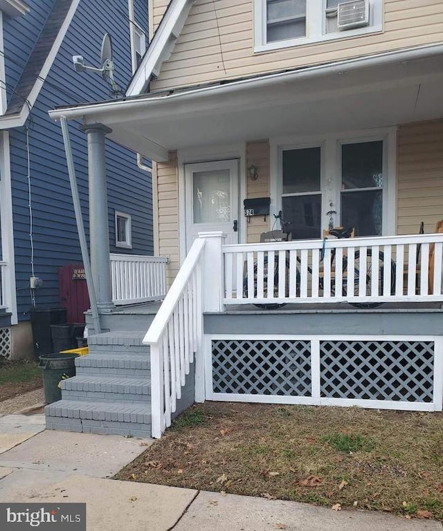 property entrance with covered porch