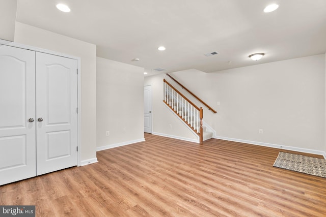 unfurnished living room with light hardwood / wood-style floors