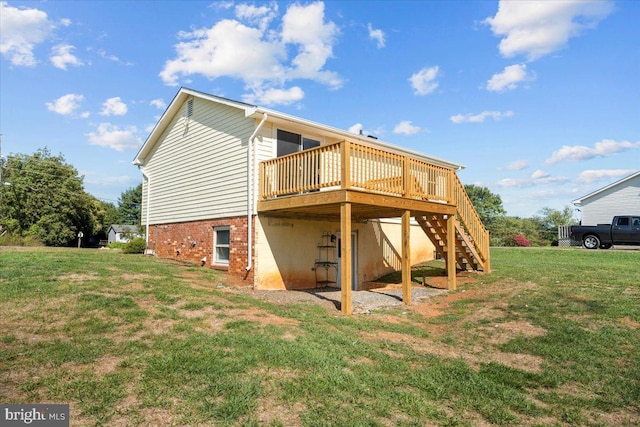 back of property with a deck and a lawn