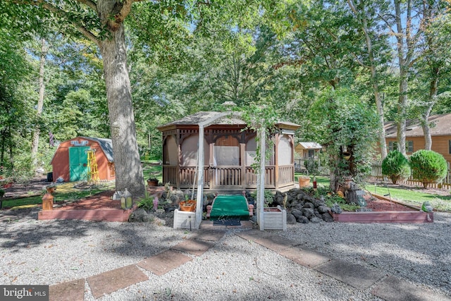 view of front of home featuring a storage shed