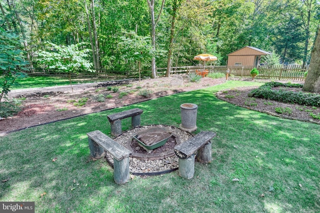 view of yard featuring an outdoor fire pit