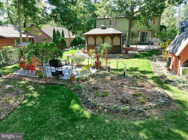 view of yard featuring a gazebo and a patio area