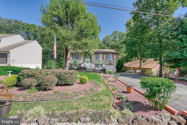 bi-level home featuring a garage