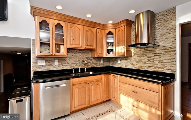 kitchen with light tile patterned flooring, tasteful backsplash, dishwasher, sink, and wall chimney exhaust hood