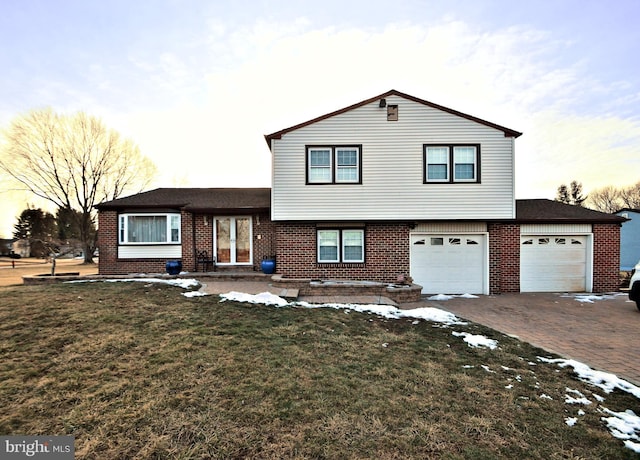 split level home featuring a yard