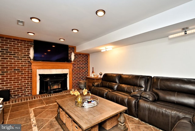 living room with brick wall and dark tile patterned flooring