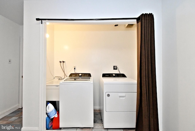 laundry area with washing machine and clothes dryer