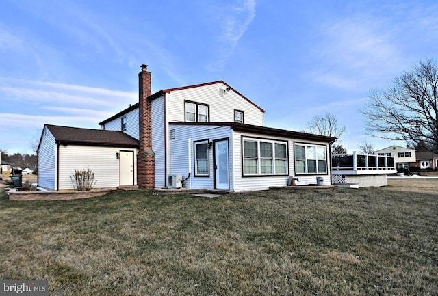 view of front of home with a sunroom and a front lawn