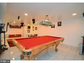 recreation room featuring tile patterned floors