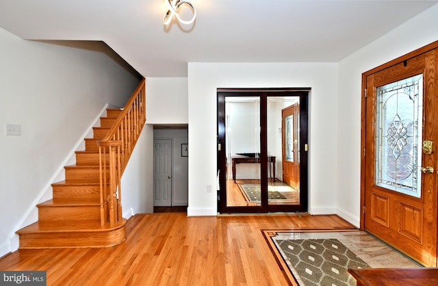 foyer with light hardwood / wood-style flooring