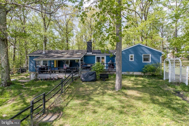 432 Swartley Rd, Hatfield, PA 19440 - rear view of property with fence, a chimney, a yard, and a deck