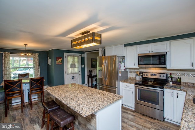 432 Swartley Rd, Hatfield, PA 19440 - kitchen featuring wood finished floors, white cabinets, and stainless steel appliances