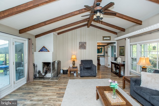 432 Swartley Rd, Hatfield, PA 19440 - living area featuring a brick fireplace, a ceiling fan, lofted ceiling with beams, and wood finished floors