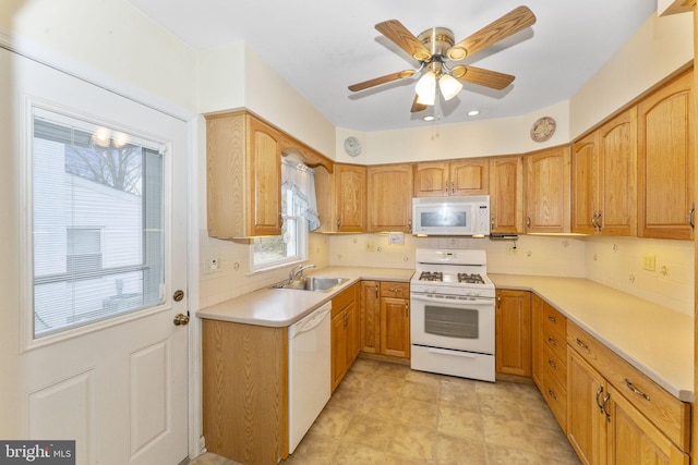 kitchen with ceiling fan, sink, white appliances, and decorative backsplash