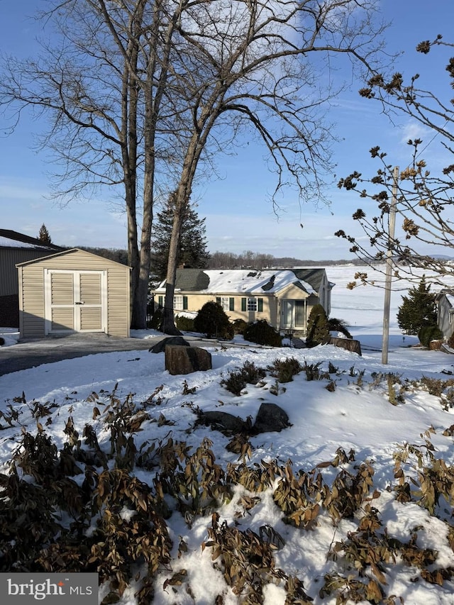 exterior space with an outbuilding and a garage