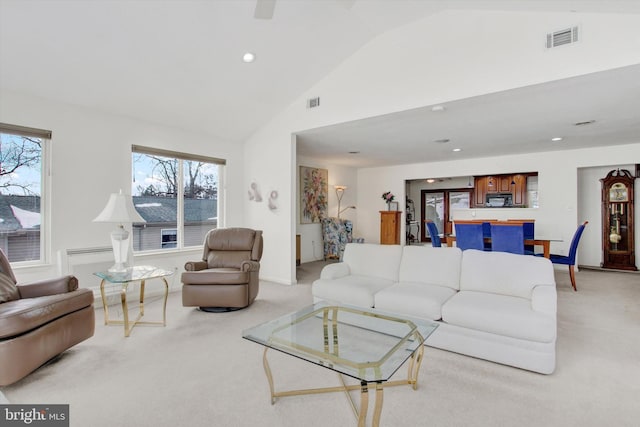 living room with light carpet and lofted ceiling